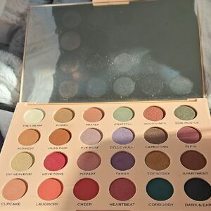 Makeup Revolution Eyeshadow Palette with Pink, Purple, and Gold